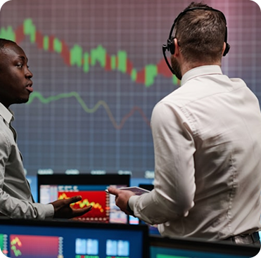 Traders analyzing markets